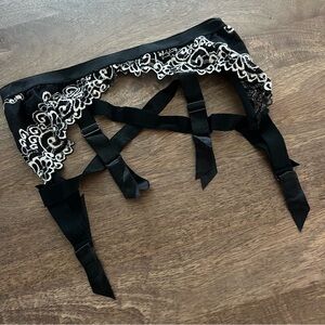 5/$40 Frederick’s of Hollywood black and lace garter belt